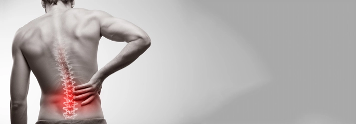 A man with back pain. His back is highlighted red.