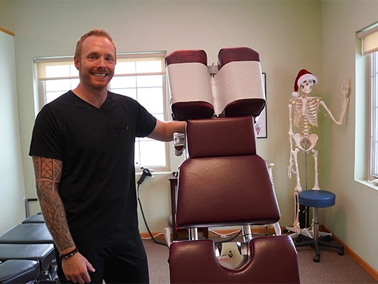 Chiropractor Michael Krueger With Adjustment Table